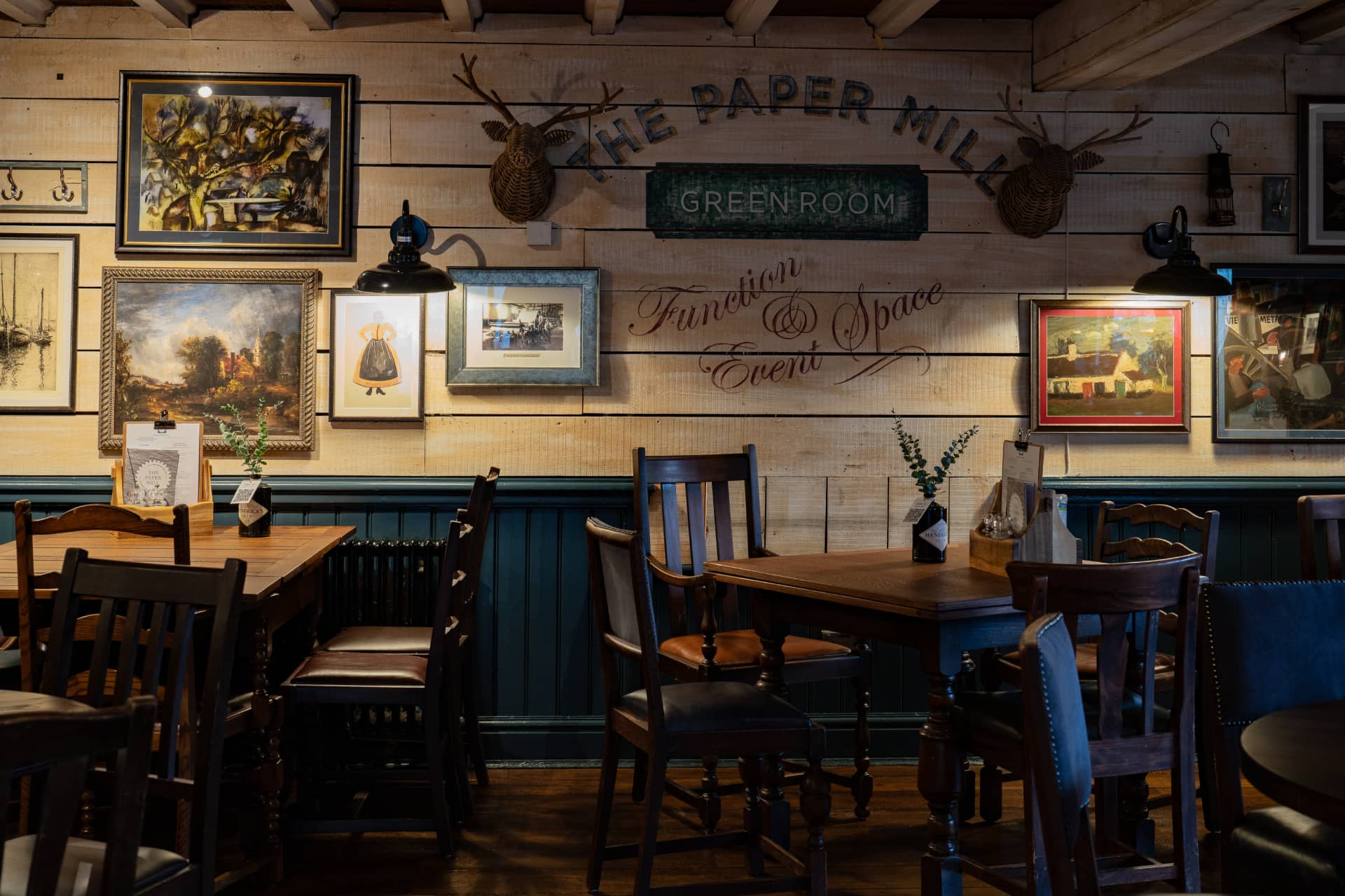 Green Room tables and chairs with decorated wall